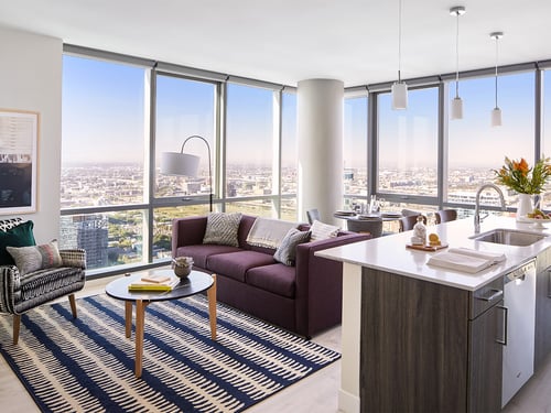 Spacious Living Room and Large Kitchen Island with Floor to Ceiling Windows at Sentral Michigan Ave