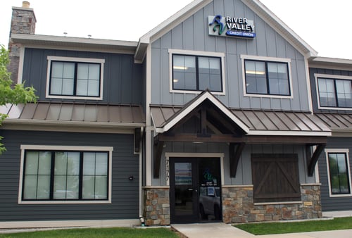 Photo of River Valley Credit Union Ada branch exterior with main entrance and building sign visible.