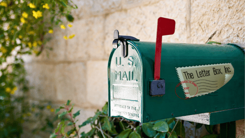 green mailbox with company logo on side