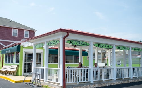 AmericanPie Pizza & Handmade Ice Cream storefront and exterior outdoor seating in Kill Devil Hills, North Carolina.
