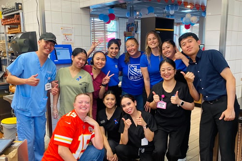 RBC employees and healthcare workers volunteering at McDonald's McHappy Day fundraiser event.
