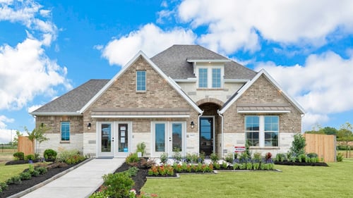 two-story home with a brick exterior