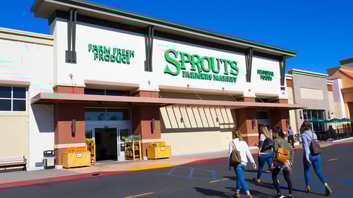 Four women walking towards entrance of Sprouts Farmers Market at Village at Mira Mesa shopping center