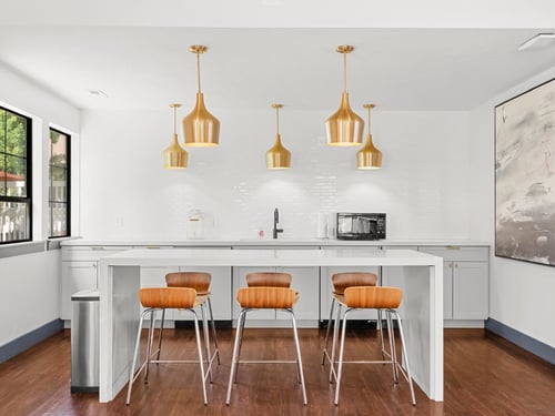 Community kitchen with a microwave and mini-fridge.