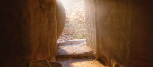 The empty tomb with the stone at the entrance moved