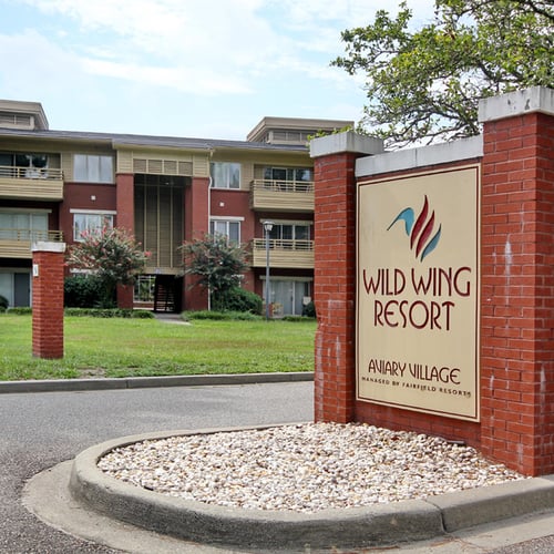 Aviary Village - Community entrance monument sign with landscaped drive