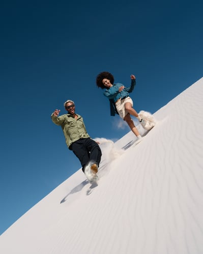 Man and woman on sand dune