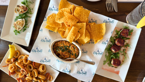Table of assorted appetizers served at Deep Blue at Kitty Knight, located in the historic Kitty Knight Inn.