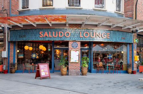A shot from outside Saludo Lounge, showcasing the circular front and dark blue colour scheme