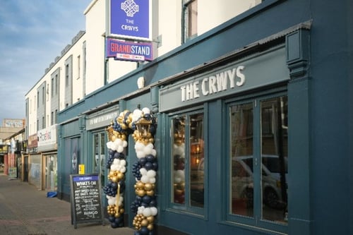 Exterior of The Crwys Hotel pub with entrance and signage