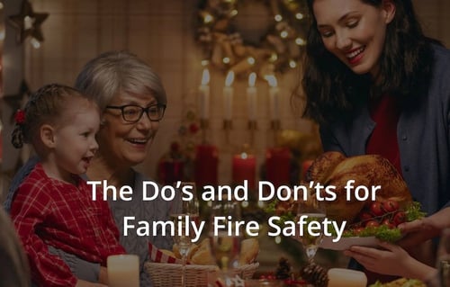 A multi-generational family enjoying a holiday dinner with fire safety text.