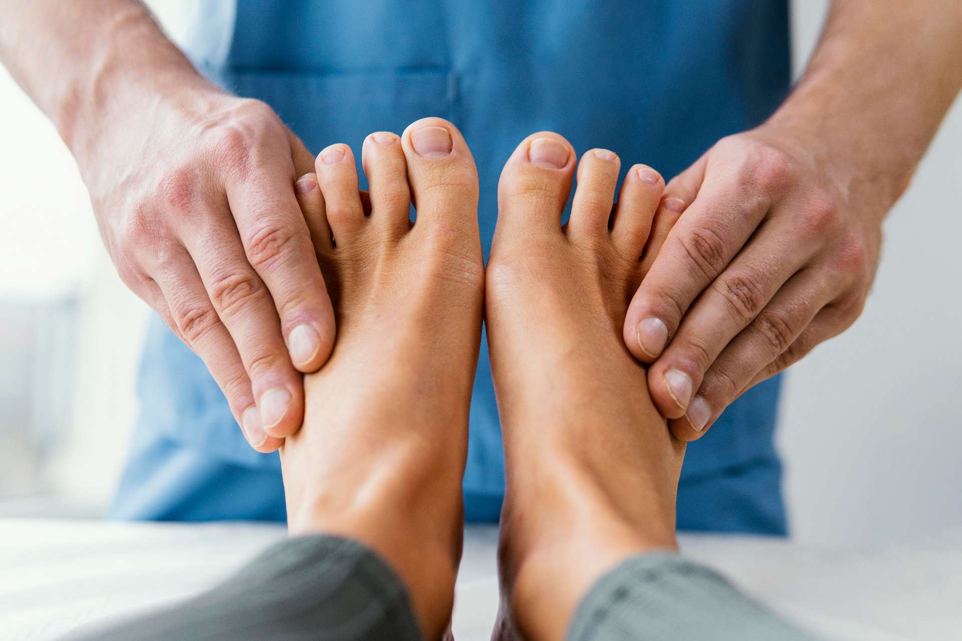 doctor giving professional care for foot pain
