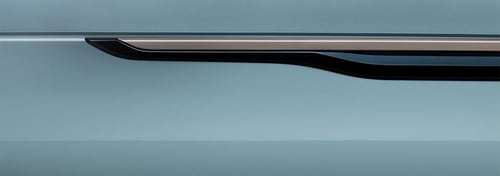Close up of black and silver design feature on light blue Range Rover