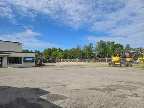 Chadwick-BaRoss sign and building with heavy equipment in background