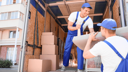 movers putting boxes on a truck