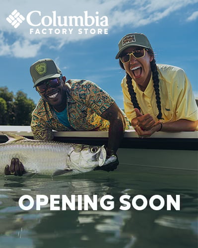 Two people in a boating. Man holding fish.