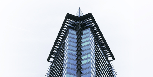 Pinnacle of a glass skyscraper.