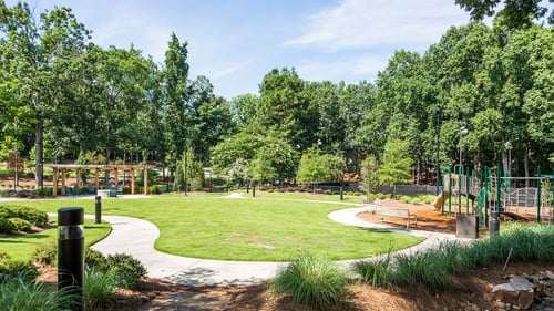 Outdoor area with walking trail and dog park.