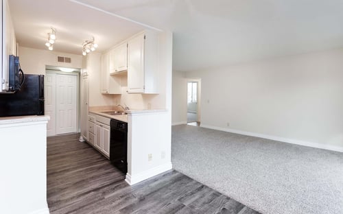 Kitchen with White Cabinets at Burbank Gardens Apartments in Sherman Oaks, CA