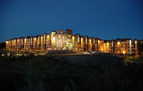 Beautiful view of the apartment building at night at The Bluffs at Nine Mile Creek, 55344