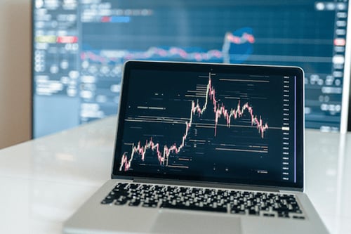 Laptop displaying a chart.