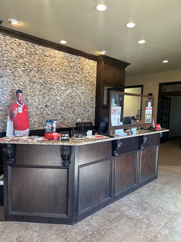 Brown desk in office with Jake from State Farm