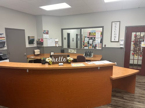 Lobby area with a front desk, creating a welcoming and organized space for parents and visitors.