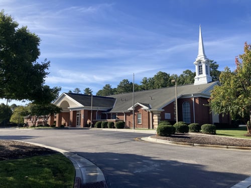 christian church building and parking lot