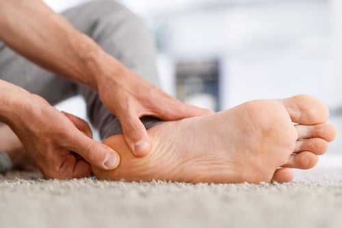 person experiencing heel pain