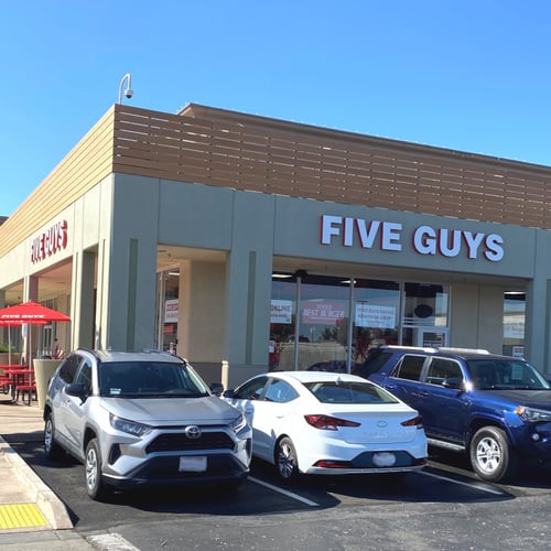 Exterior photograph of the entrance to the Five Guys restaurant at 1201 Marina Boulevard in San Leandro California.
