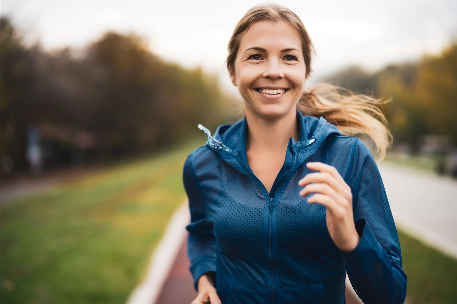 woman happy to be running outdoors