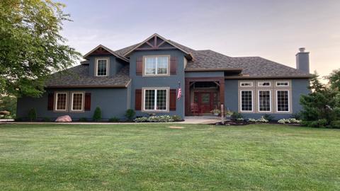 Exterior painting project in Urbandale, Iowa completed by Harmony Painting, known for high-quality residential repainting services.