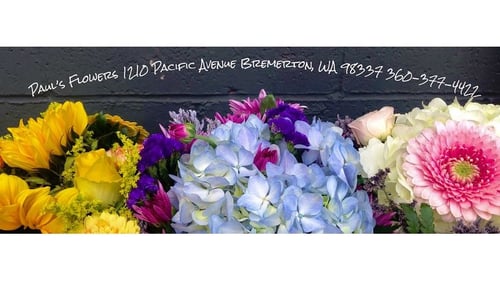 different colored flower bouquets next to each other