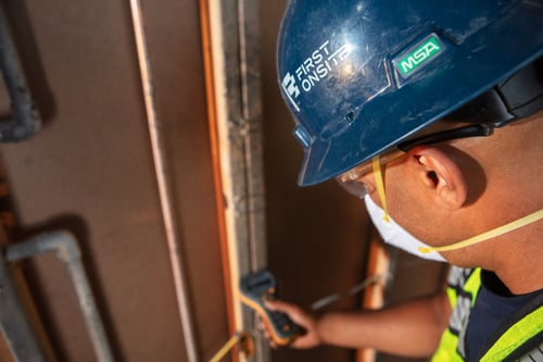 Restoration professional completes moisture mapping after demolition as part of the water damage restoration process to prevent mold growth.