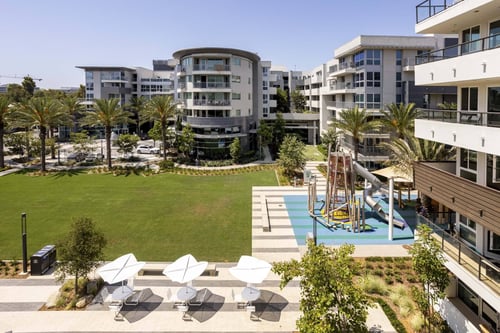 Aerial view of Elements that shows a green lawn and a resting area.