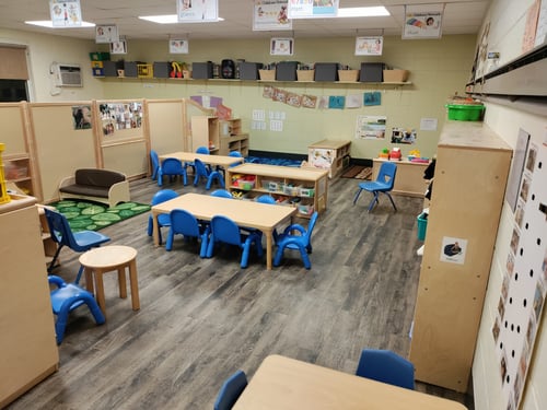 Fun, interactive room for older 2-year-olds, filled with toys, art supplies, and age-appropriate learning stations.