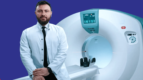 doctor standing in front of an MRI machine