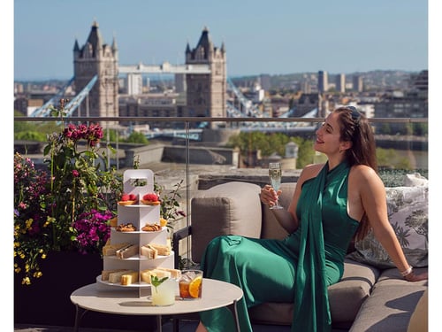 customer enjoying a beverage overlooking Tower Bridge.
