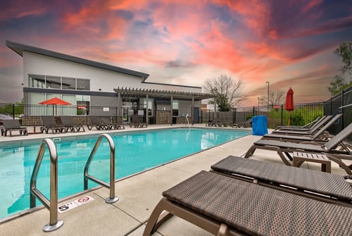 our apartments have a large swimming pool and lounge chairs at Lake Shore Place Apartments, Ankeny, Iowa
