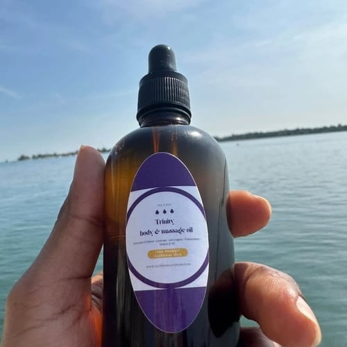 brown bottle of Trinity Body Oil