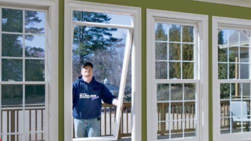 Mainline Glass of Friendswood employee installing large glass windows