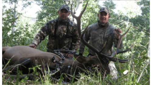 two hunters with elk