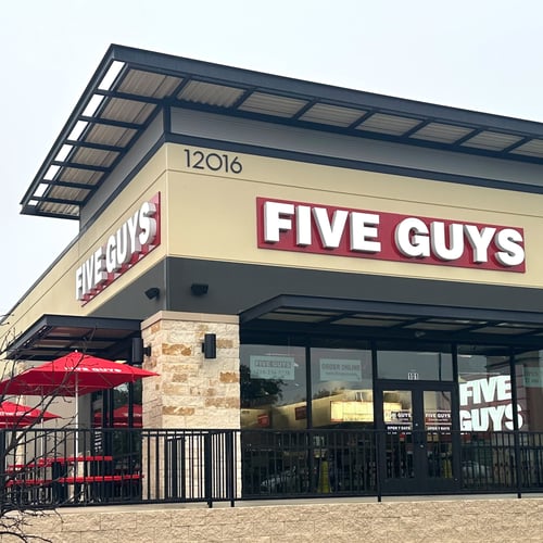 Exterior photograph of the Five Guys restaurant at 12016 Alamo Ranch Parkway in San Antonio Texas.