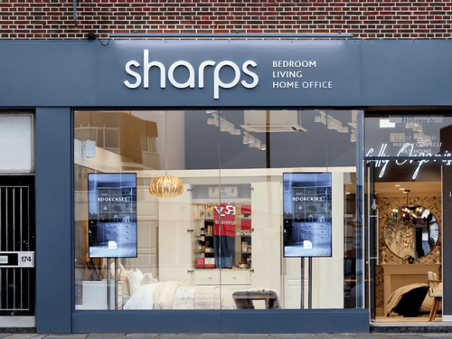 Guildford Sharps Showroom on High Street, with window displays of Sharps fitted furniture.