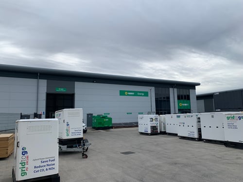 Sunbelt Rentals Clean Energy depot in rugby, outside shot in the yard with battery storage units placed around.