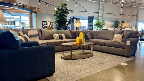 Woodbury Slumberland Furniture L-shaped sectional and blue chair