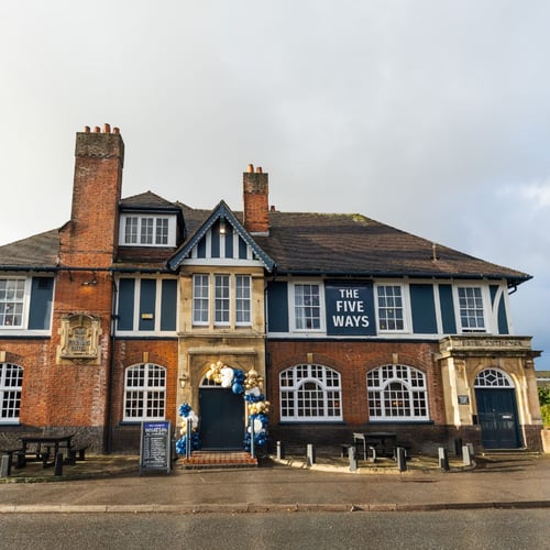 Exterior of The Fiveways pub with signage and entrance
