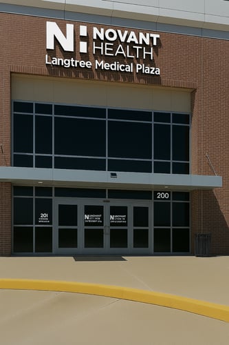Exterior entrance of Novant Health Langtree Medical Plaza building with glass doors.