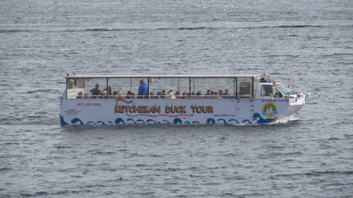 Whiite duck tour boat on the water