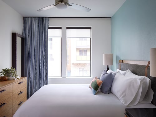 Bedroom with Large Windows at Sentral East Austin at 1614 E. 6th